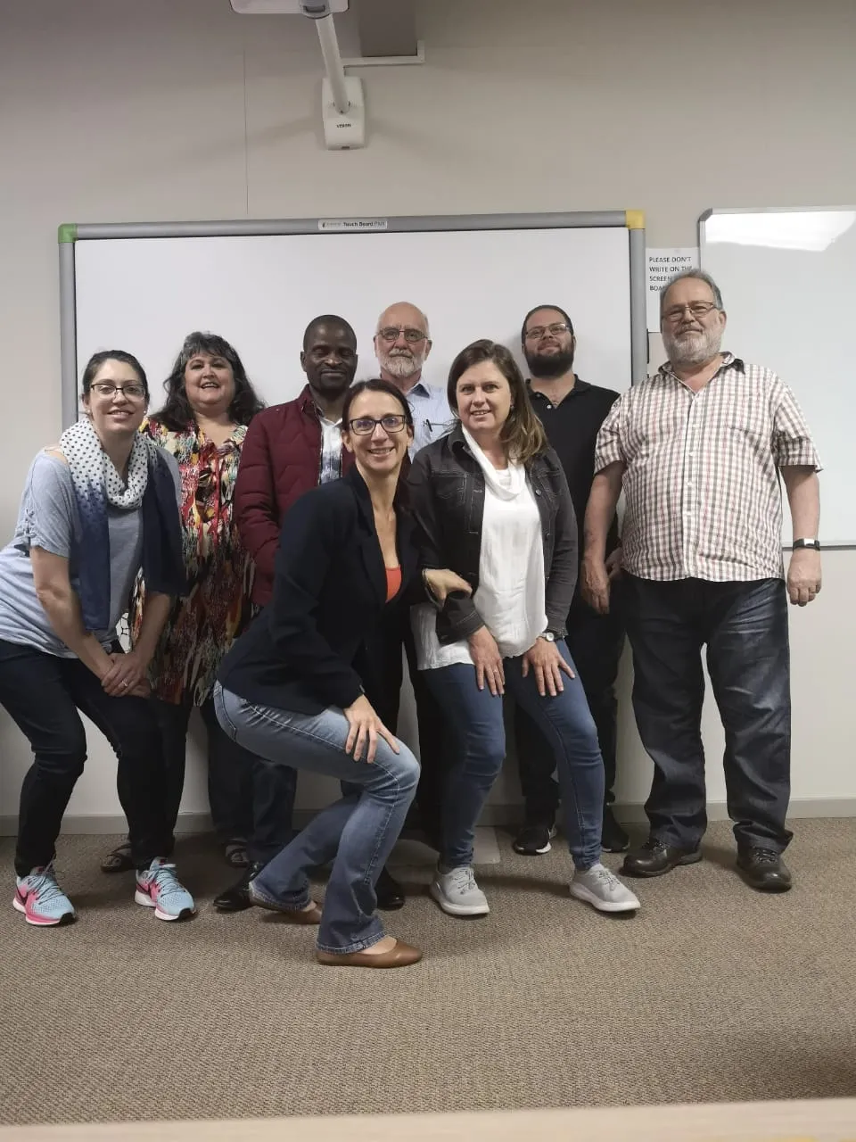 professional learners and instructor smiling