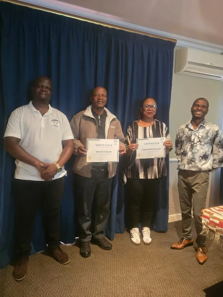 professional learners and instructor smiling